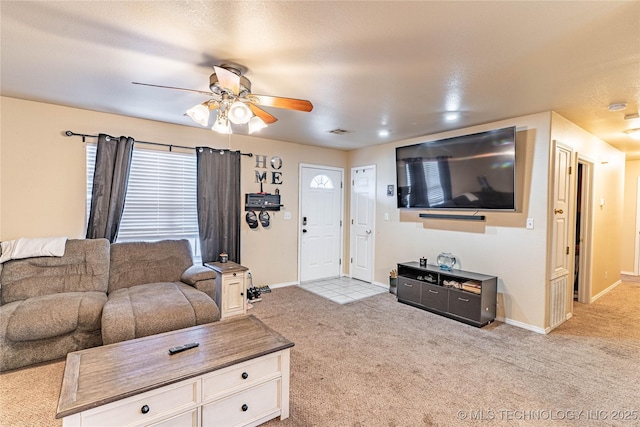 living room with ceiling fan and light carpet