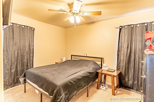 bedroom featuring ceiling fan and light carpet