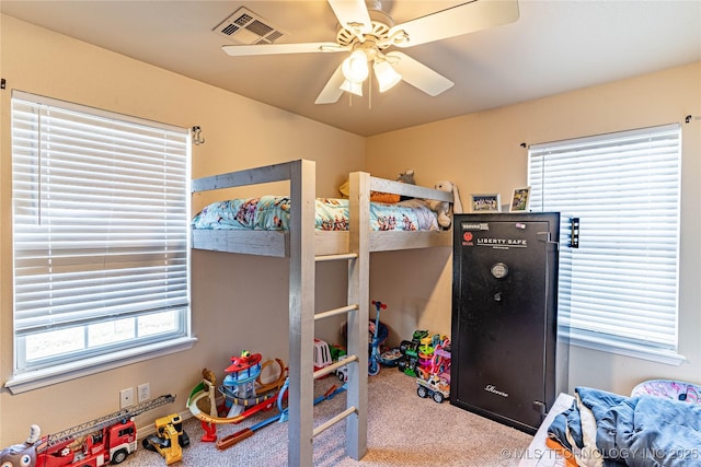 carpeted bedroom with ceiling fan