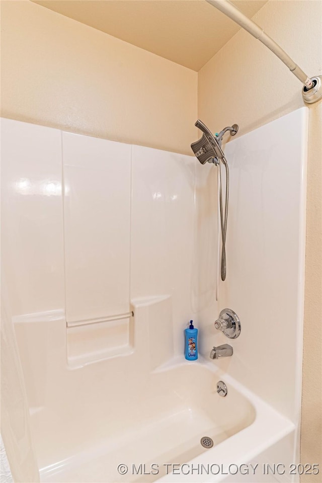 bathroom with shower / bath combo