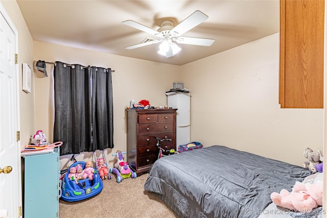 bedroom with ceiling fan and carpet