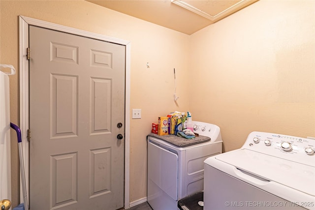 clothes washing area featuring washing machine and clothes dryer