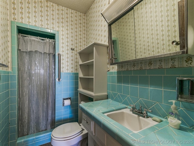 bathroom featuring tile walls, toilet, vanity, and a shower with shower curtain