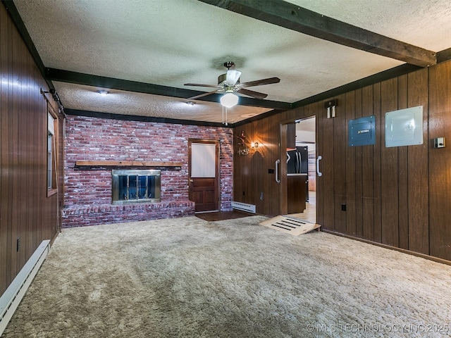 unfurnished living room featuring wood walls, a textured ceiling, a baseboard heating unit, and beam ceiling