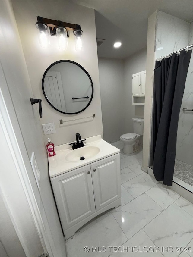 bathroom with toilet, vanity, and a shower with curtain