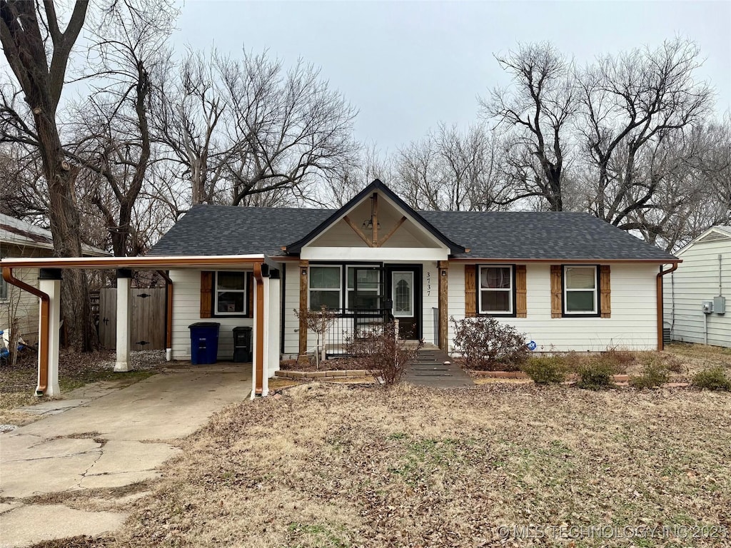 ranch-style home featuring a carport