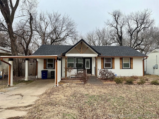 ranch-style home featuring a carport