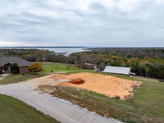 birds eye view of property with a water view