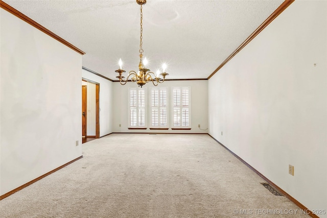 unfurnished dining area with ornamental molding, light colored carpet, an inviting chandelier, and a textured ceiling