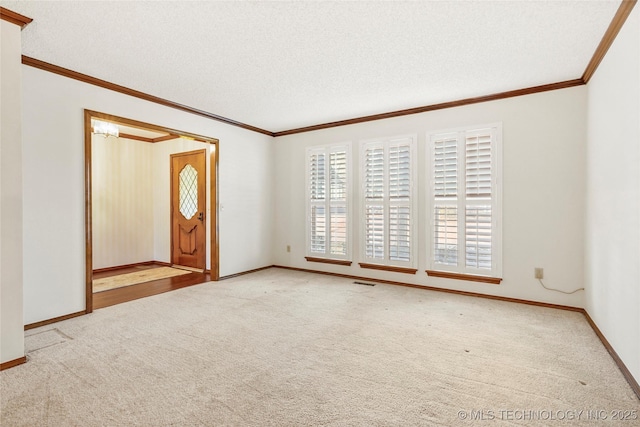 spare room featuring light colored carpet