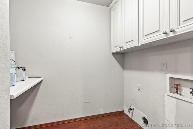 laundry area featuring washer hookup, electric dryer hookup, dark hardwood / wood-style flooring, and cabinets