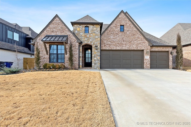 view of front of house with a front yard and a garage