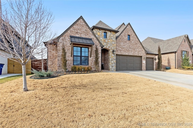 view of front of property featuring a garage and a front lawn