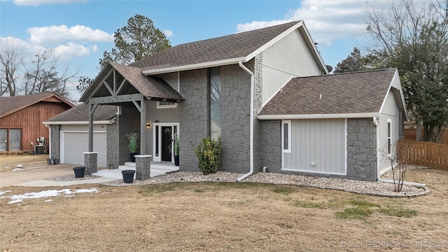 view of front facade with a garage and a front yard