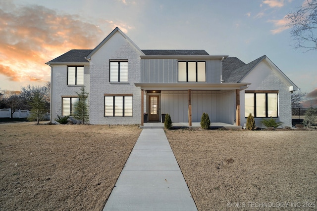 view of front of home with a yard