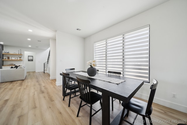 dining room featuring light hardwood / wood-style flooring