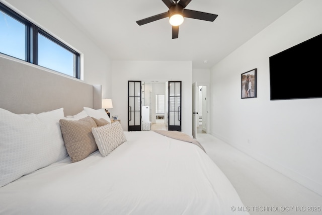 bedroom featuring ceiling fan and ensuite bathroom