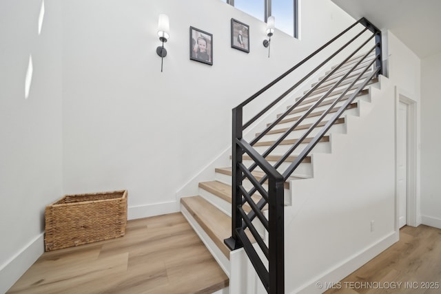 stairs with wood-type flooring