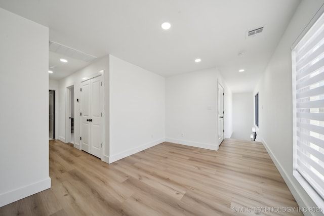 spare room with light wood-type flooring