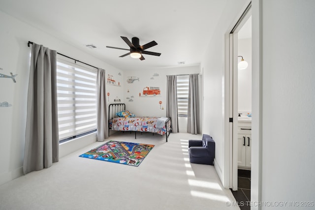 carpeted bedroom featuring ceiling fan