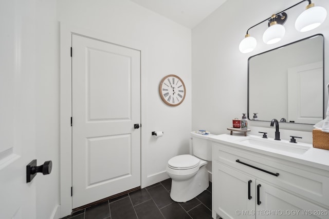 bathroom with tile patterned floors, vanity, and toilet