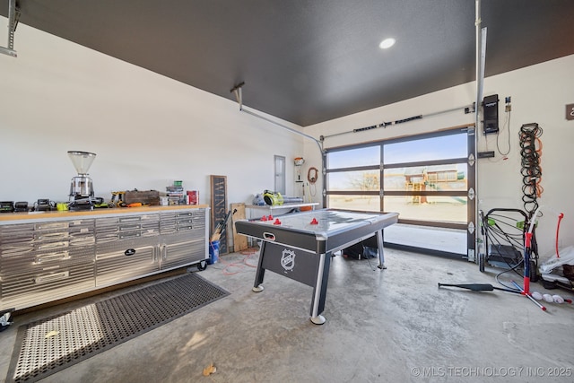 recreation room with concrete flooring