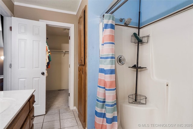 bathroom with tile patterned floors, vanity, and ornamental molding