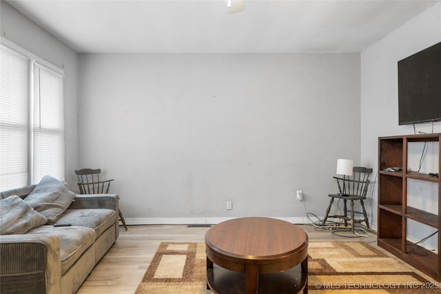 living room with light hardwood / wood-style flooring