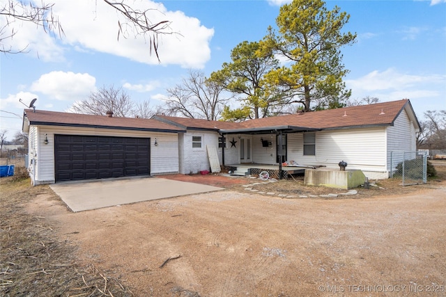 ranch-style home with a porch and a garage