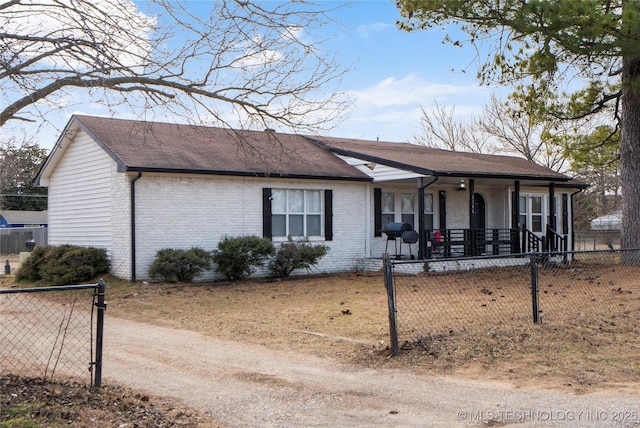 view of side of home featuring covered porch