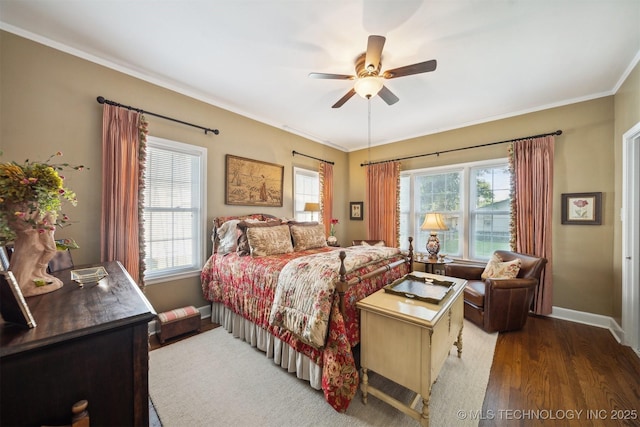 bedroom with ceiling fan, dark wood-type flooring, and ornamental molding