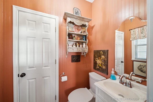 bathroom with toilet and vanity