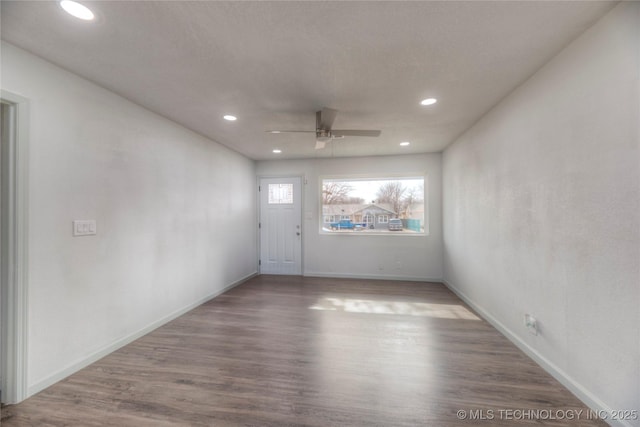 unfurnished room featuring ceiling fan and hardwood / wood-style floors