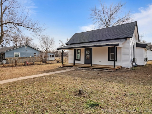 view of front of house with a front yard and a porch