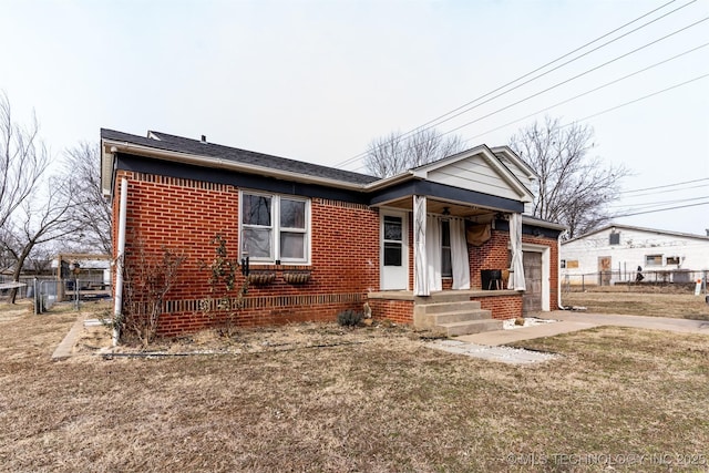 view of front of house with a front lawn and a garage