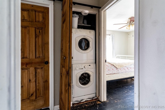 laundry area featuring ceiling fan and stacked washer and dryer