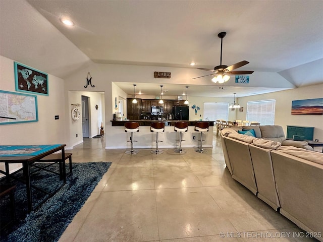 living room featuring vaulted ceiling and ceiling fan