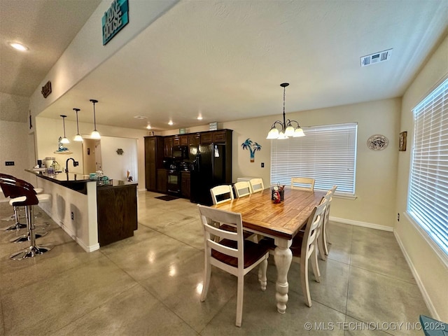 dining room with a chandelier