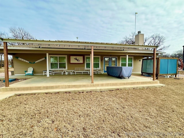 rear view of property with a patio