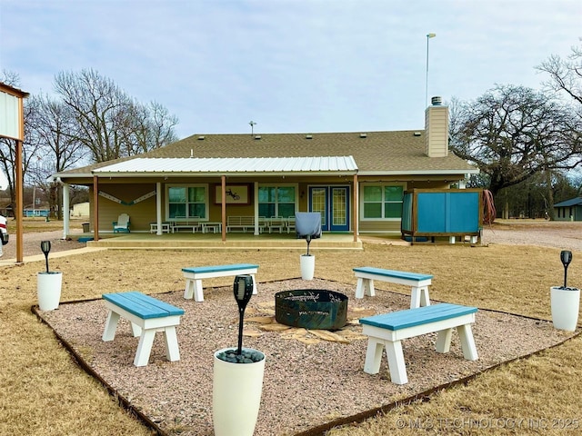 exterior space with a fire pit