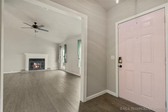 entrance foyer with ceiling fan, dark hardwood / wood-style flooring, and lofted ceiling