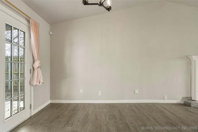 interior space with dark wood-type flooring and a chandelier