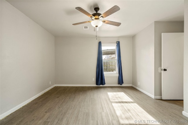 unfurnished room featuring ceiling fan and light hardwood / wood-style flooring