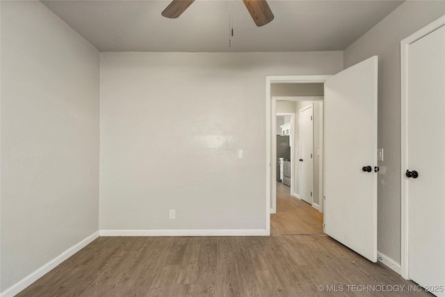 unfurnished room featuring ceiling fan and hardwood / wood-style flooring