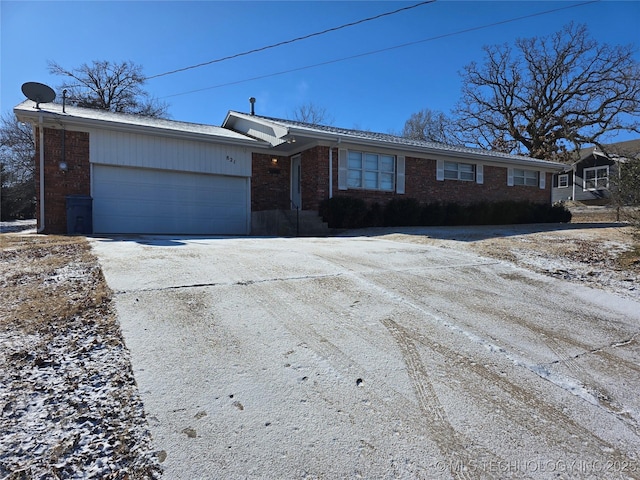 ranch-style house featuring a garage