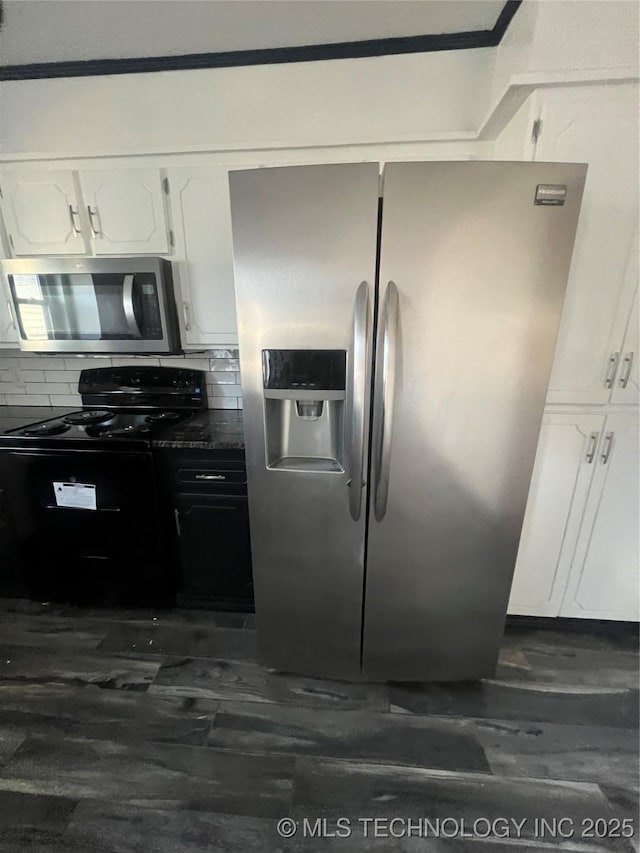 kitchen featuring white cabinets, decorative backsplash, dark wood-type flooring, and stainless steel appliances