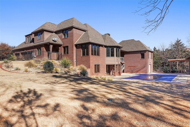 exterior space with a covered pool and a patio area