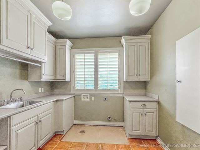 kitchen featuring sink and light tile patterned floors