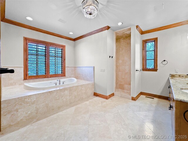 bathroom featuring plus walk in shower, vanity, a notable chandelier, and ornamental molding