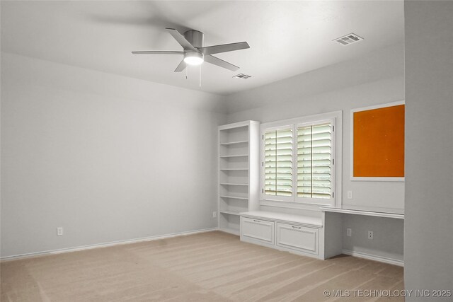 interior space with ceiling fan